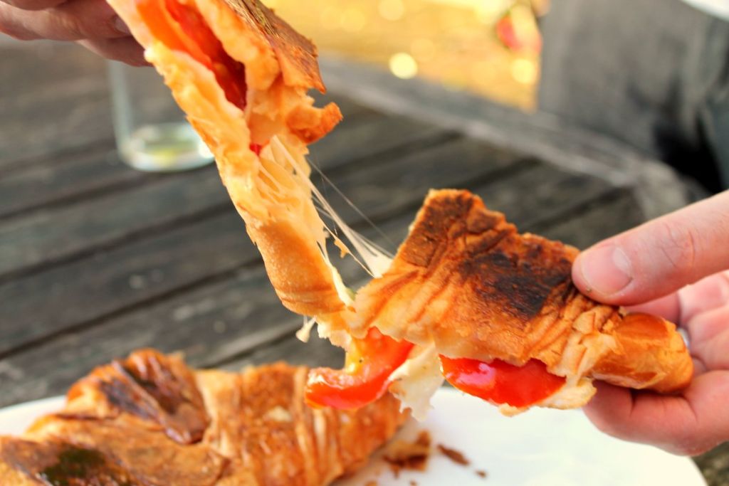 The perfect vegetarian breakfast sandwich! A toasted croissant with a melted mozzarella cheese and tomato filling. If you're looking for a new croissant sandwich filling idea, this is the one to try.