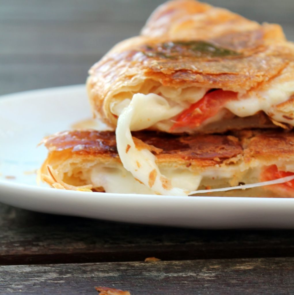 The perfect vegetarian breakfast sandwich! A toasted croissant with a melted mozzarella cheese and tomato filling. If you're looking for a new croissant sandwich filling idea, this is the one to try.