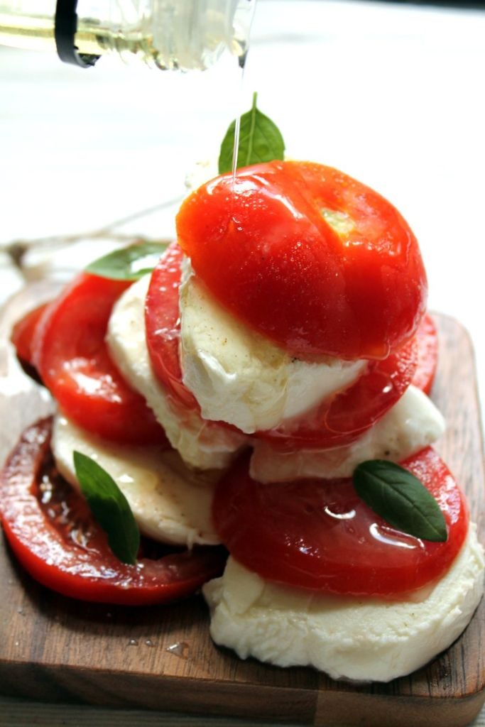 Caprese salad drizzled with smoked olive oil. A delicious and unexpected twist on a classic!