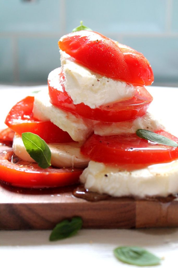 Caprese salad drizzled with smoked olive oil