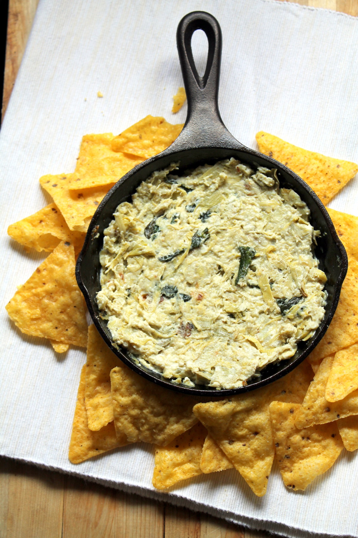 Simple feta and artichoke dip. 6 ingredients and nothing to chop! Much lighter than the usual artichoke dip, but I think it's actually tastier!