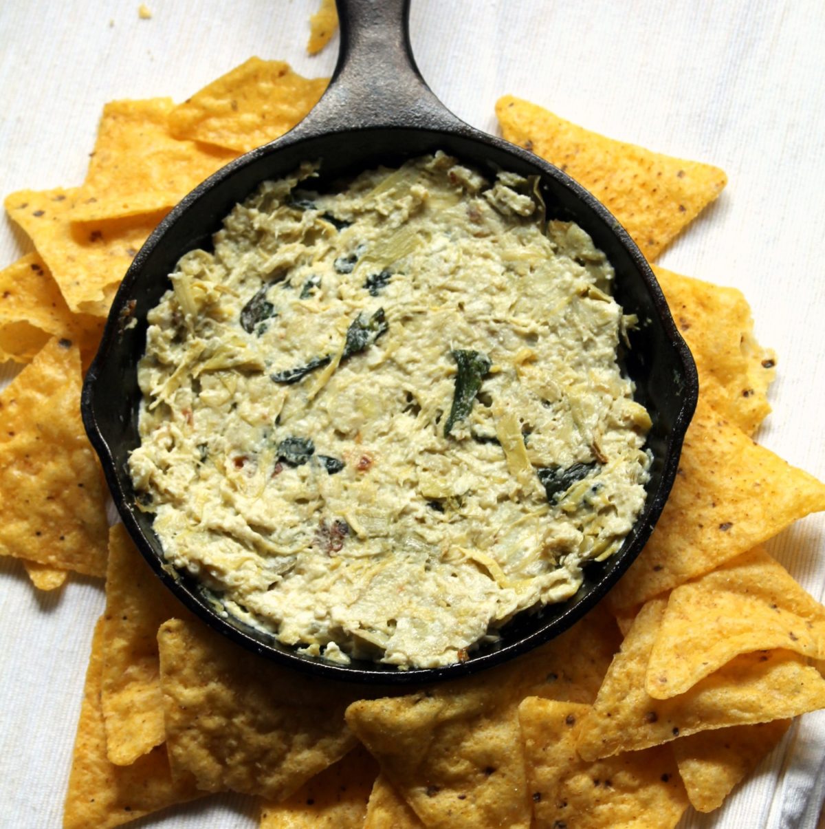 Simple feta and artichoke dip. 6 ingredients and nothing to chop! Much lighter than the usual artichoke dip, but I think it's actually tastier!