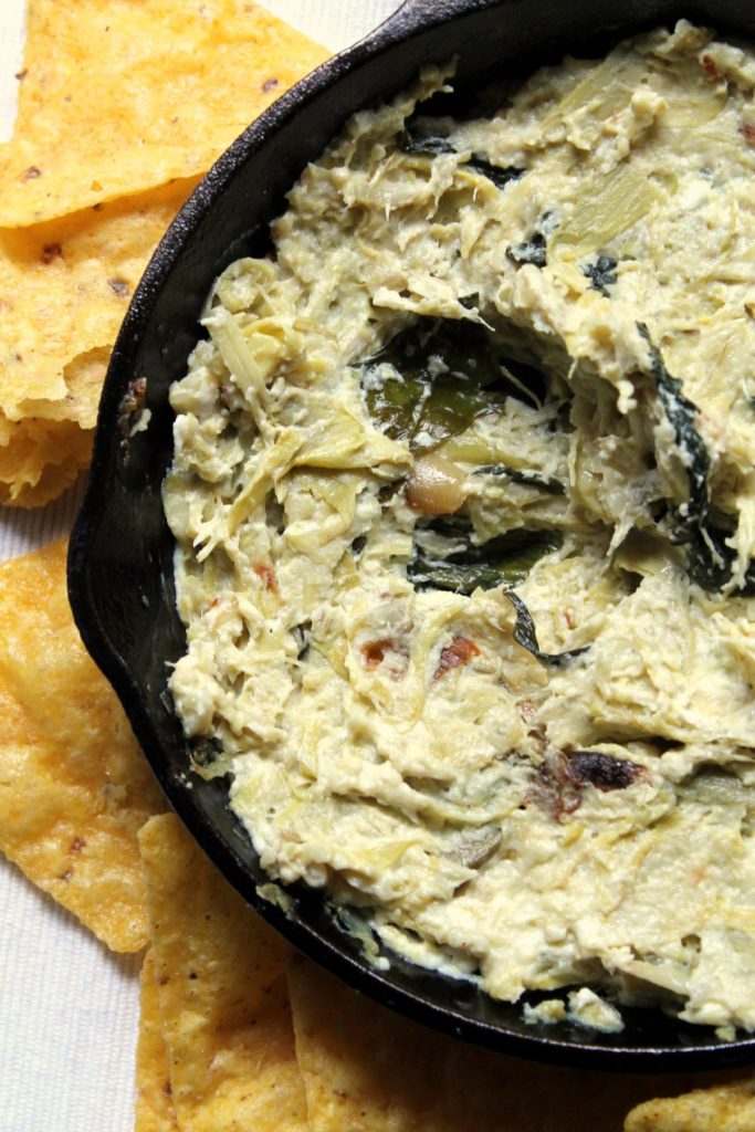 A simple and delicious recipe for baked artichoke and feta cheese dip. Only 5 ingredients, no chopping, very little prep, an hour in the oven, and it's done! This is a light and fresh tasting dip which really lets the artichoke and feta tastes come through.