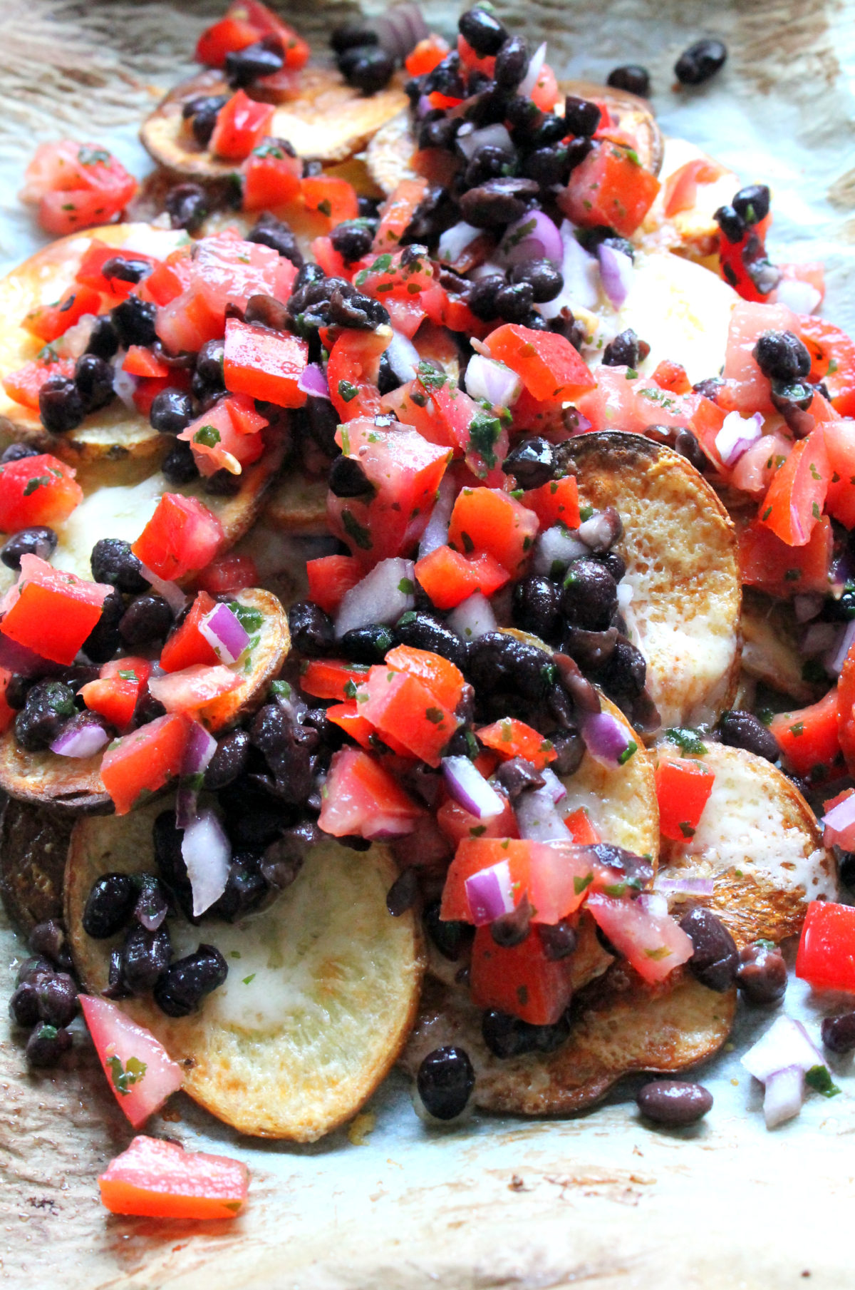 These "tree hugger" nachos were inspired by a trip to the Swizzle Inn, Bermuda. But they have been made a little healthier by using baked potato slices instead of tortilla chips, to fit my post-vacation healthy eating kick!