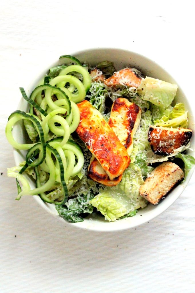 A greek inspired vegetarian caesar salad . Greek yogurt dressing infused with green olives, and halloumi cheese!