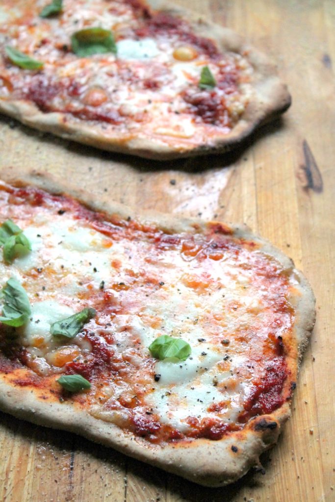 Home made sourdough pizzas! Mini pizzas with a rye sourdough crust and three cheeses. Delicious flavors but so simple. Incredible #vegetarian lunch or snack.