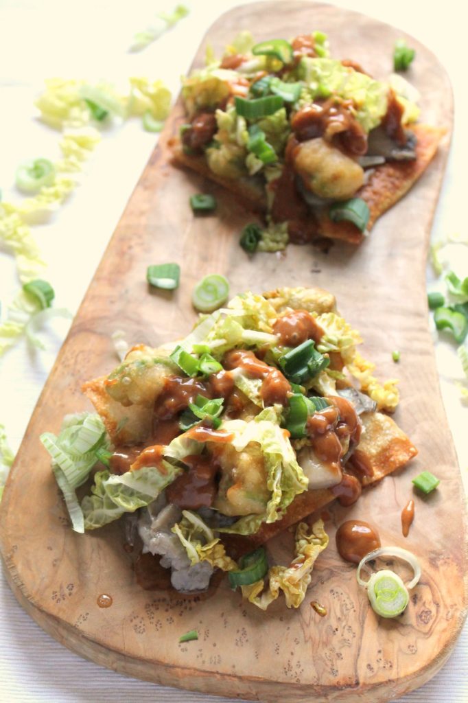 Delicious fusion tostadas with beer battered avocado, drunken mushrooms, slaw and peanut sauce. We had such a great time making these.