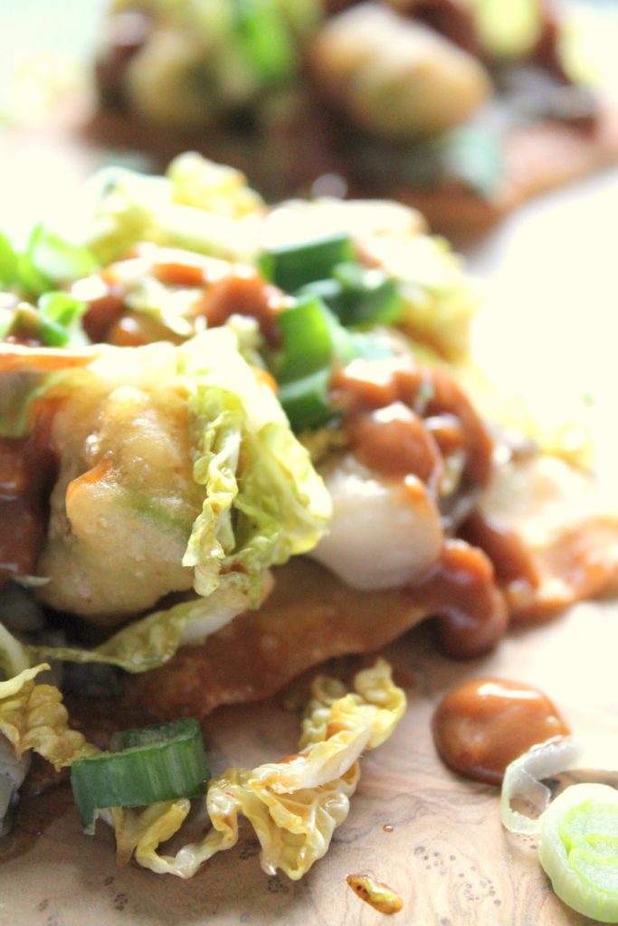 Delicious fusion tostadas with beer battered avocado, drunken mushrooms, slaw and peanut sauce. We had such a great time making these.