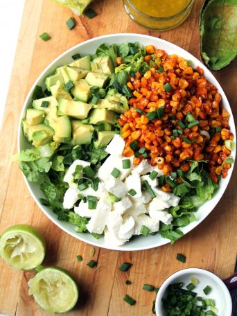 This is a fresh, flavorful vegetarian salad (tastes particularly amazing next to a plate of enchiladas!)