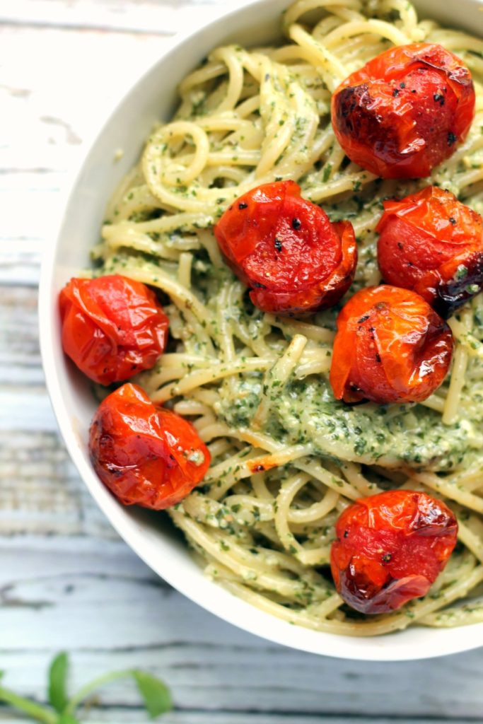 You can't go wrong with a big bowl of pasta with roasted / blistered cherry tomatoes. This recipe uses roasted garlic pesto which is creamy, tasty and naturally vegan. The cherry tomatoes are blistered and intensely flavorful too. You'll be hooked on this simple vegetarian pasta dinner. Best served with a glass of wine!