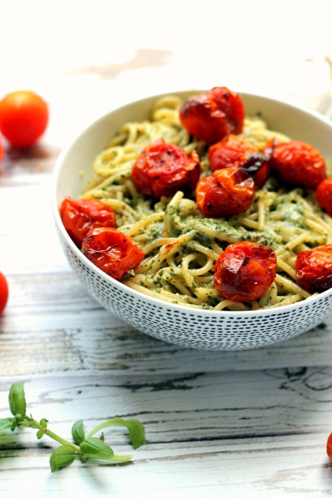 You can't go wrong with a big bowl of pasta with roasted / blistered cherry tomatoes. This recipe uses roasted garlic pesto which is creamy, tasty and naturally vegan. The cherry tomatoes are blistered and intensely flavorful too. You'll be hooked on this simple vegetarian pasta dinner. Best served with a glass of wine!