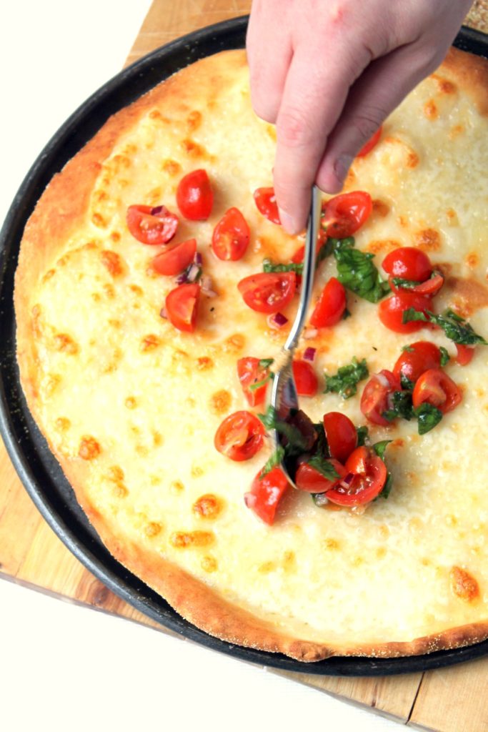 This caprese pizza takes a few simple ingredients and turns them into something amazing. The easy no-yeast buttermilk pizza dough requires no proofing, and turns out deliciously crisp and flavourful. 