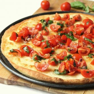 A light, fresh pizza for summer. The crispy thin crust is easy to make and doesn't require any yeast.