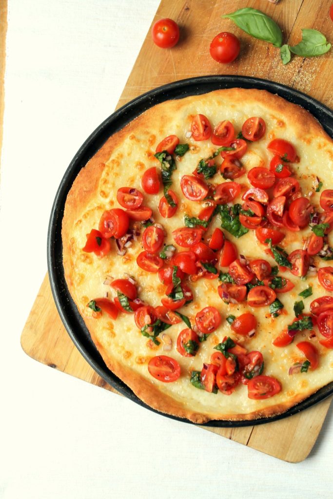 This caprese pizza takes a few simple ingredients and turns them into something amazing. The easy no-yeast buttermilk pizza dough requires no proofing, and turns out deliciously crisp and flavourful. 