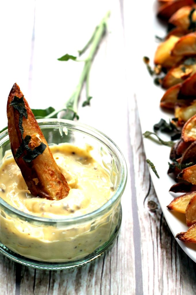 Incredibly tasty oven baked potato wedges served with a home made truffle mayonnaise dip. It tastes fancy but is an easy snack or side dish to make at home, and worth a little extra effort to make your own truffle mayo! Treat yourself!