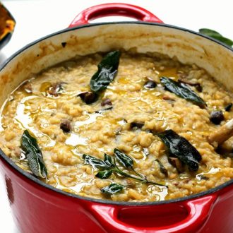 This vegan risotto is baked in a dutch oven with roasted autumnal veggies, sage and a drizzle of truffle oil. So tasty and creamy, you will not miss the cheese!