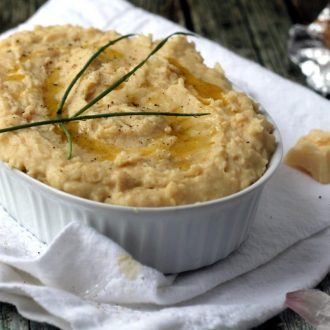 A great lower-GI alternative to mashed potatoes! I couldn't believe how creamy and comforting bean mash can be. These are packed with roasted garlic and cheddar cheese for maximum flavor.
