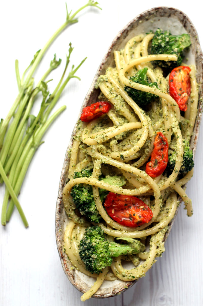 Use a whole broccoli in this pasta dish by turning the stems into a fresh, lemony basil and broccoli pesto. A light, healthy, vegetarian + vegan pesto pasta dinner, ready in 25 minutes.