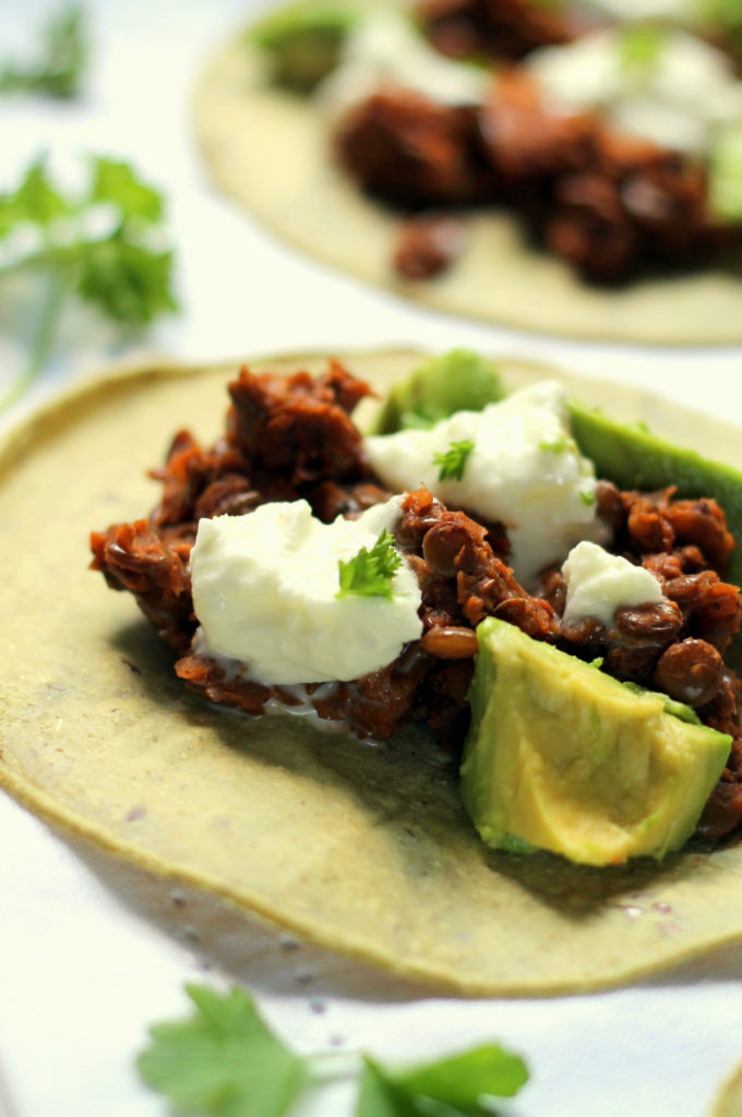 These easy vegetarian lentil tacos are ready in under 30 minutes! The lentils are deliciously spiced and smoky, with fresh tangy mozzarella and creamy avocado to top it off. Using canned green lentils makes this recipe come together quickly and easily, for a healthy 30 minute dinner.
