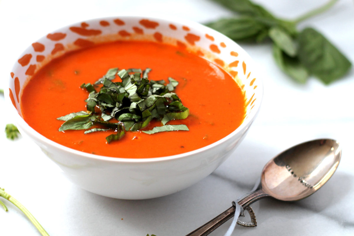 This dairy free tomato soup is incredibly rich and creamy thanks to the addition of roasted garlic! Vegan and gluten free, a total crowd pleaser.