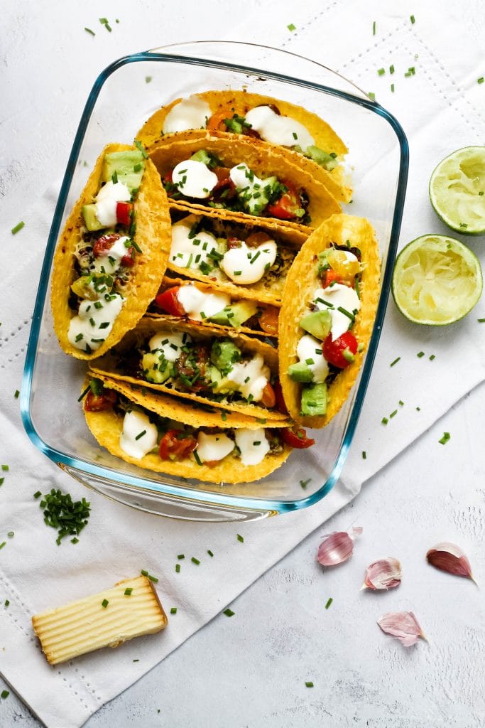 Oven baked bean and cheese tacos with a variety of toppings