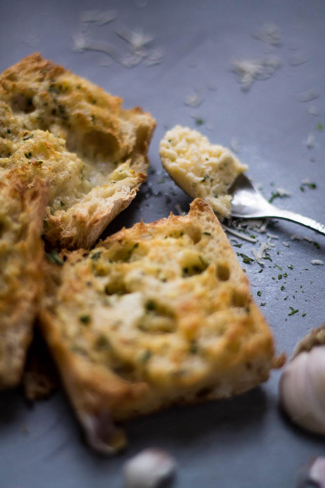 Air fryer garlic bread with focus on the garlic butter