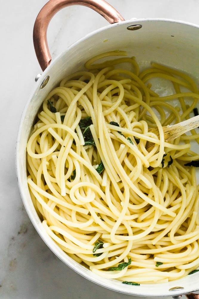 A pan of pasta with sage butter sauce