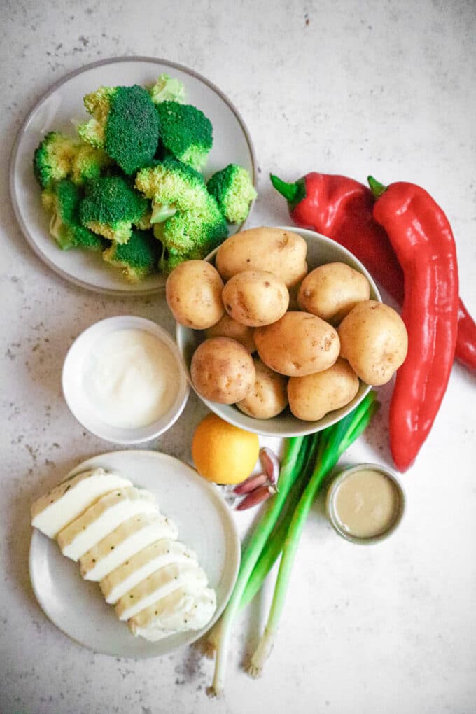 A photo of the ingredients required for roasted halloumi, potato and broccoli tray bake.