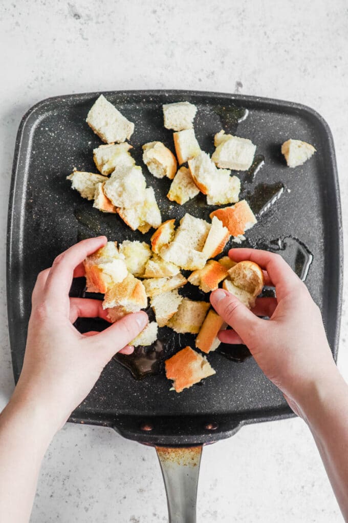 Croutons being prepared on a frying pan