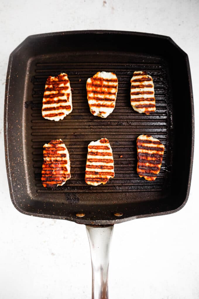 Cooked halloumi on a grill pan