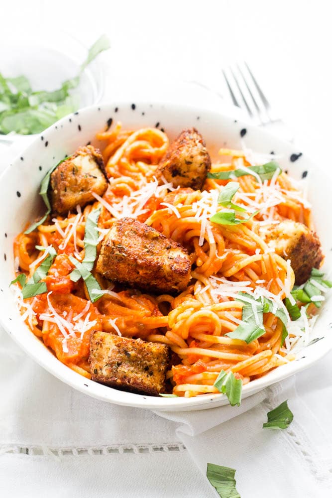 Bowl of spaghetti with fried halloumi balls on top