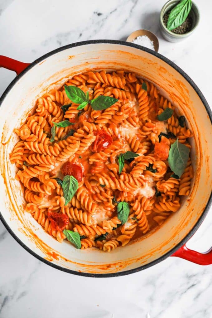 A pot of finished pasta with tomato mascarpone sauce