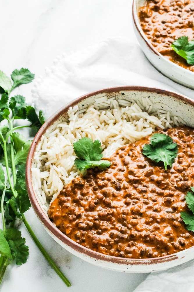 Side angle of dishoom dal in a bowl